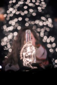 glass bottle with lots of lights