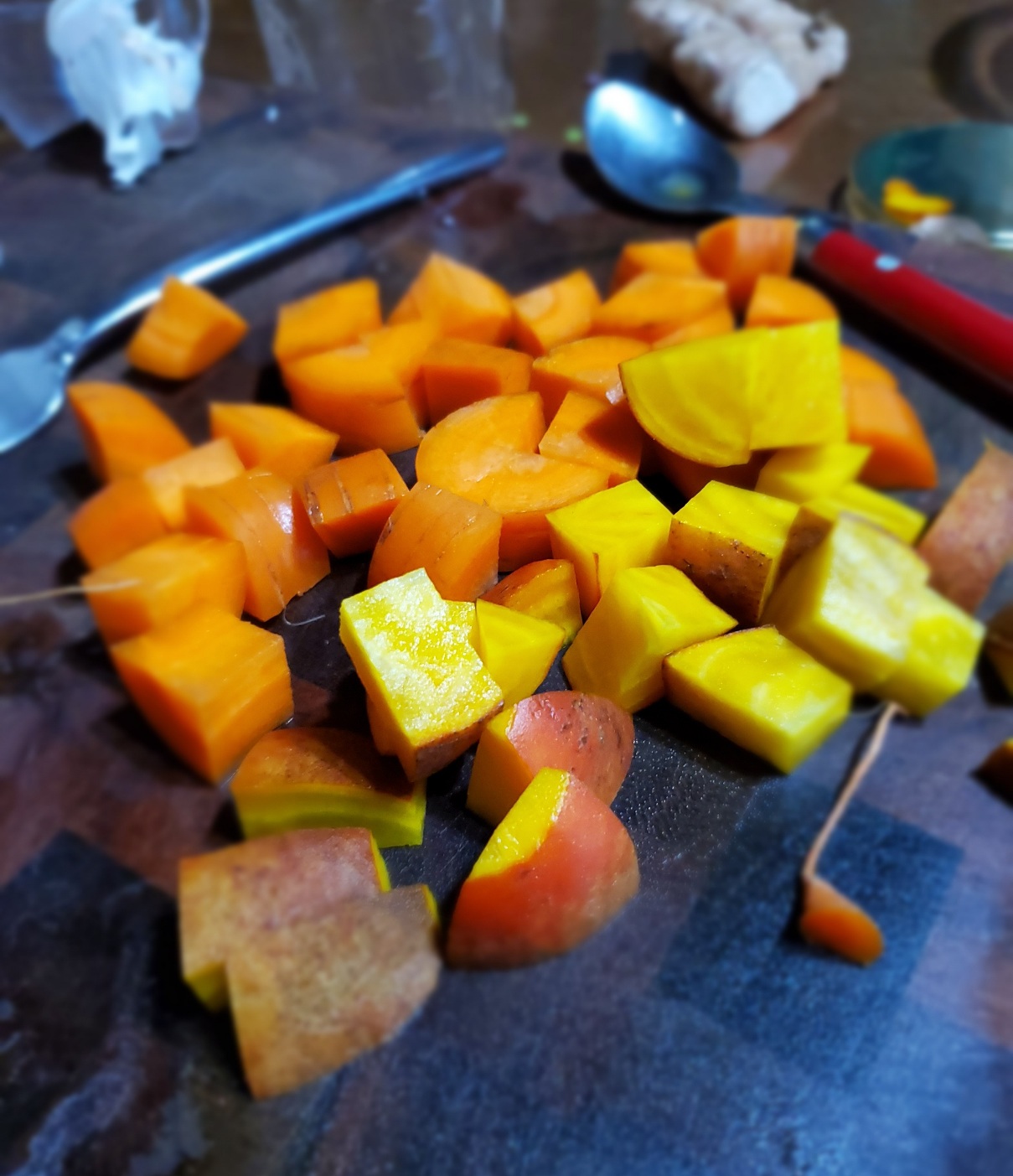 chopped cubes of raw carrots and yellow beets