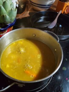Kitchari cooking in a silver pot