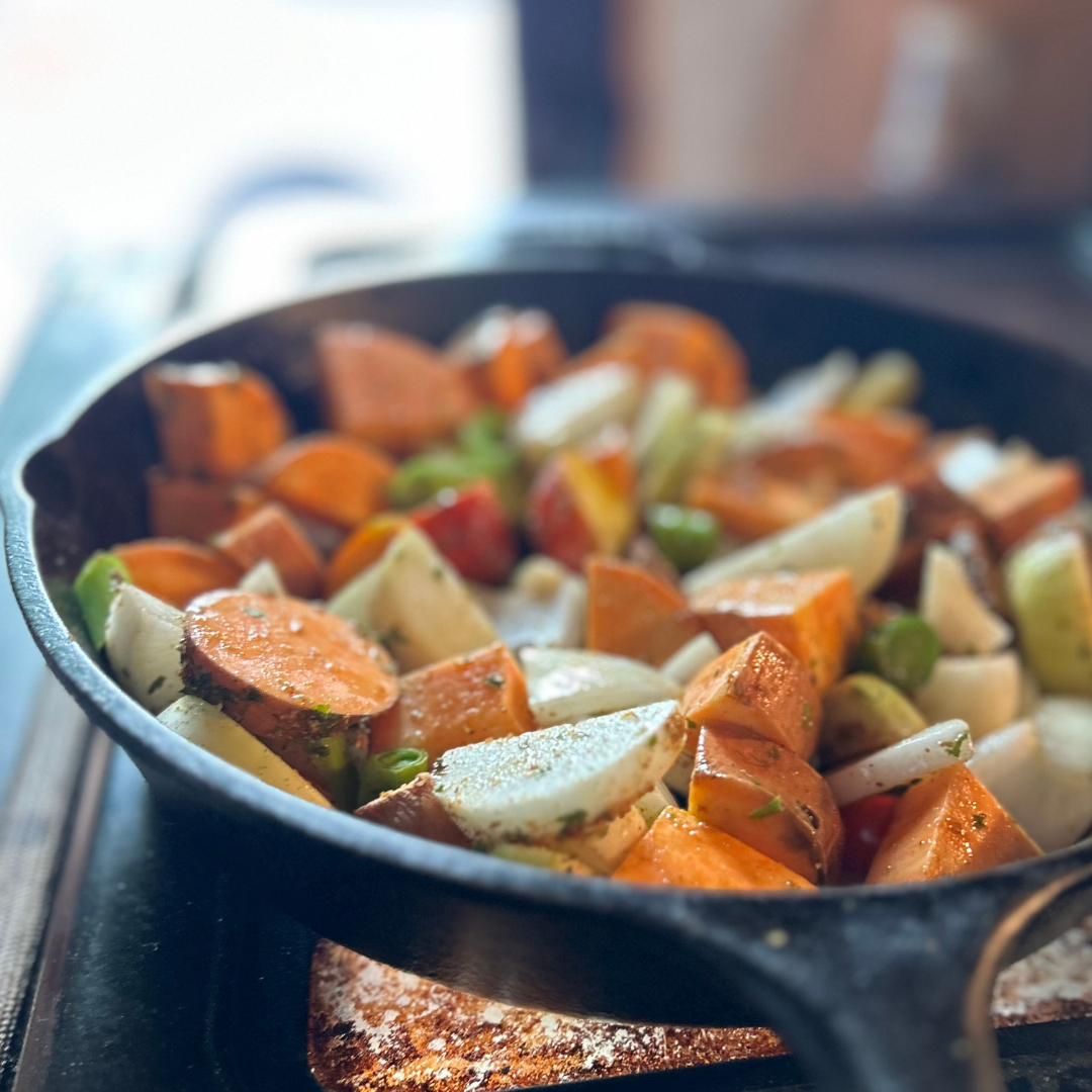 sauté pan with chopped roasted colorful root vegetables