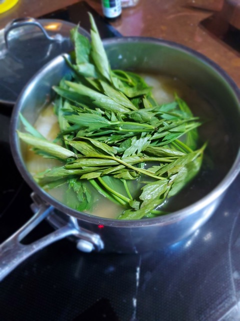 leaves in soup pot for lovage soup